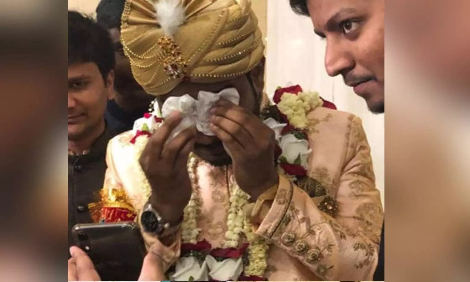Groom crying at his marriage event