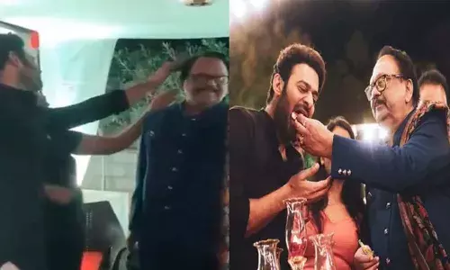 Prabhas Adjusting Krishnam Raju Hair