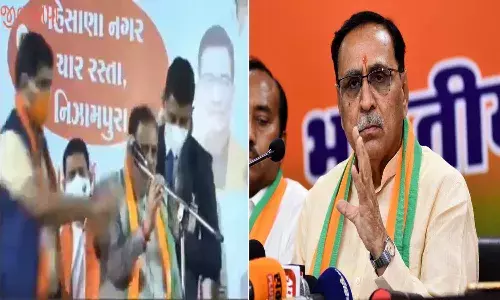 Gujarat CM Vijay Rupani faints on stage during rally in Vadodara.