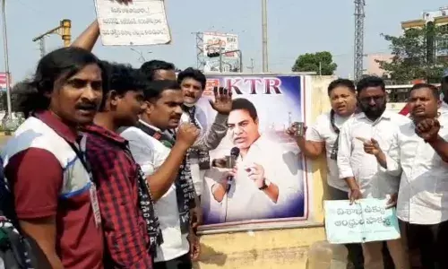 Vizag steel plant workers milk anointing to ktr photo