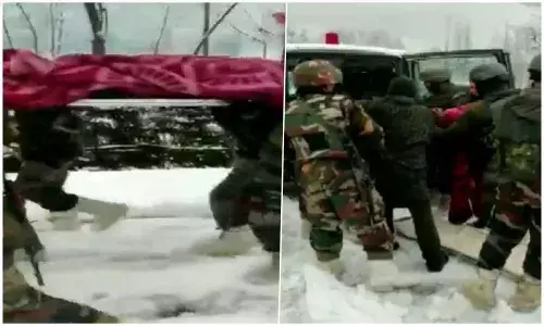 army person carried Pregnant woman on a cot