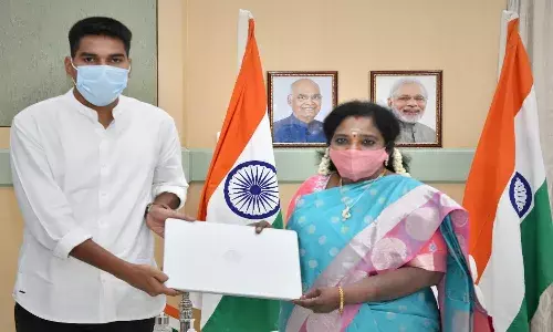 Telangana Governor presents laptop to a needy student