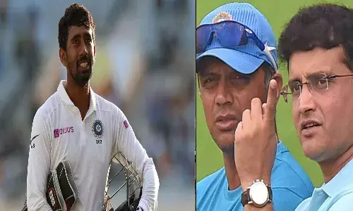 కోచ్ ద్రావిడ్ రిటైర్ అవ్వమన్నాడు : సాహా