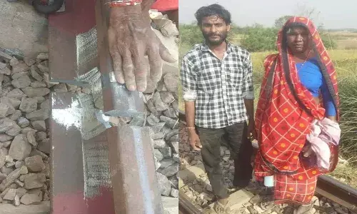ట్రాక్పై పగుళ్లను గమనించి.. తన ఎరుపు రంగు చీరను తీసుకుని వచ్చి..
