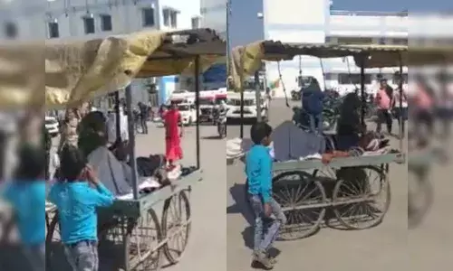 తోపుడు బండిపై తండ్రిని ఆసుపత్రికి తీసుకెళ్లిన ఆరేళ్ల బాలుడు