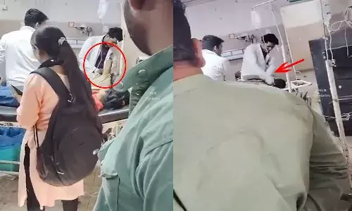 madhya pradesh, doctor suspended,  beating patient, video,
