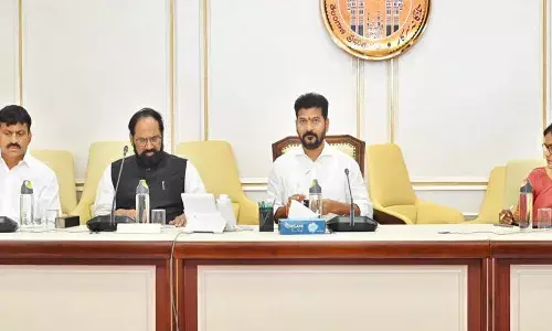 two guarantees, implementation, cm revanth reddy,