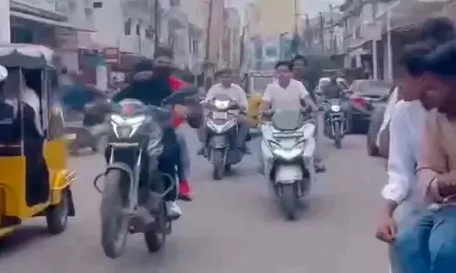 Hyderabad, man booked , bike stunts, burqa