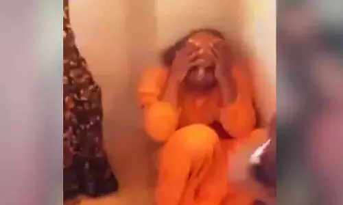 ISKCON priest, beaten, woman