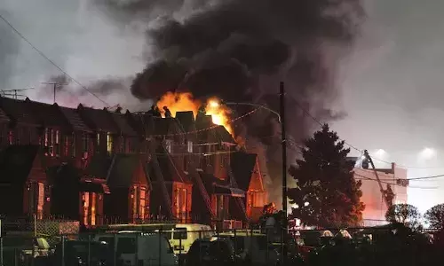 Small plane carrying 2 crashes in Philadelphia, homes on fire, deaths feared