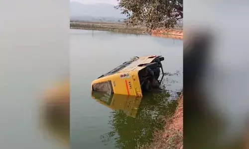 Andhra Pradesh, Srikakulam, school bus falls into pond