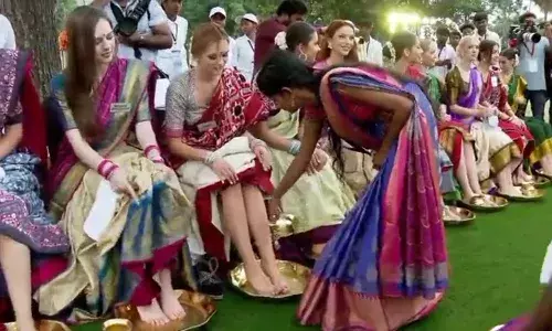 Political storm, Telangana, women washing Miss World contestants feet