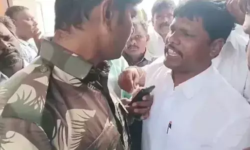 APnews, Minister cousin slaps cop, temple, arrest