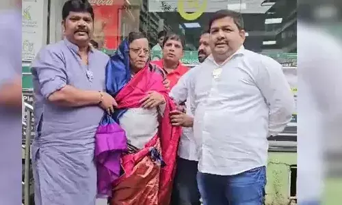 BJP workers, Congress leader, wear saree, morphed PM Modi post