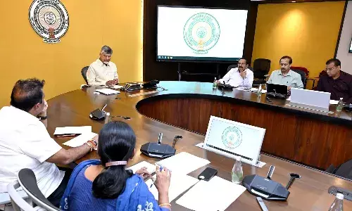 CM Chandrababu, officials, distribute new Pattadar passbooks, APnews