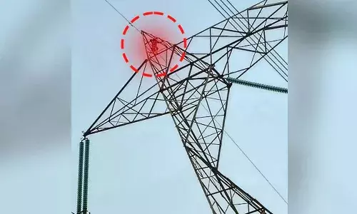 Woman climbs power tower, fair ride, Madhya Pradesh, Singrauli district